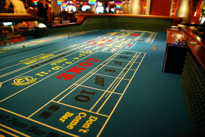 Playing craps one of these tables.
